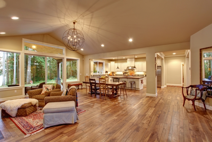 An open space for dining and family rooms, with beautiful wood floors
